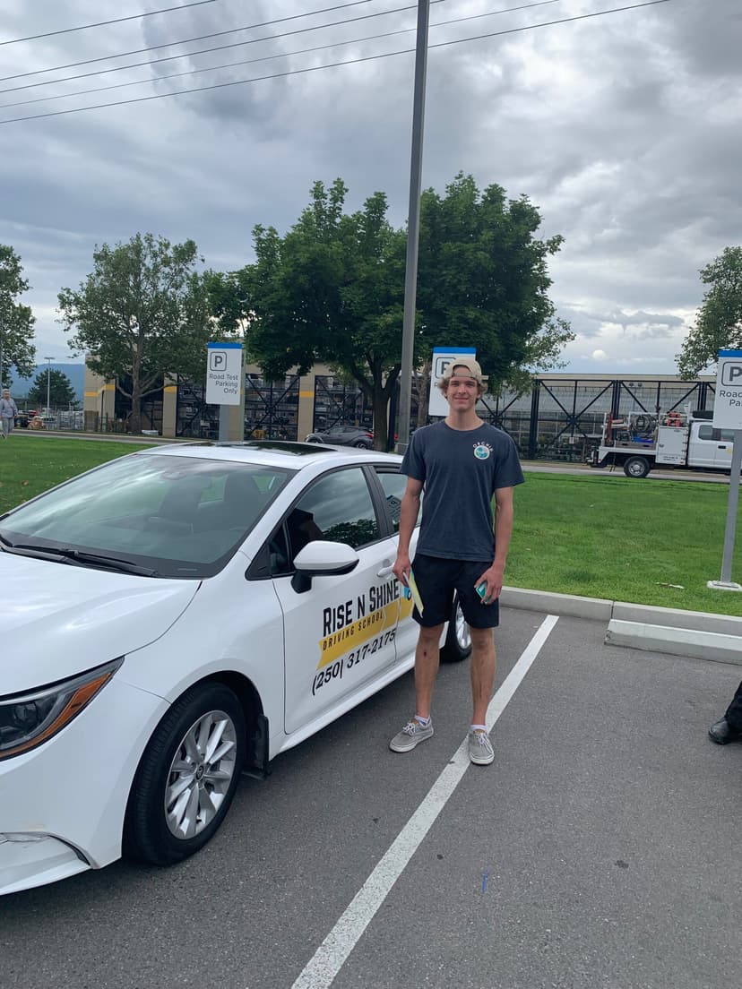 Successful student celebrating driver's license